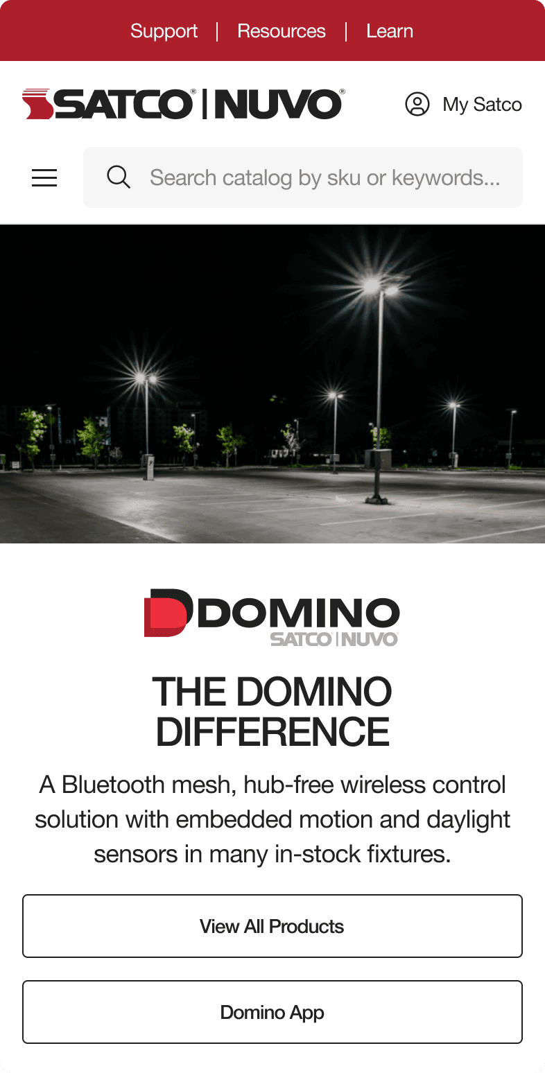 SATCO|NUVO Domino mobile page with a lit parking lot at night and description of the hub-free Bluetooth mesh control system
